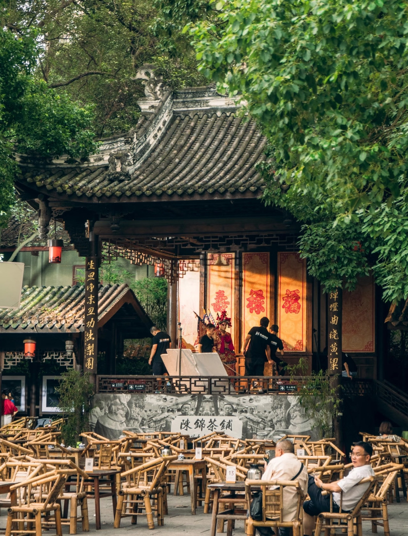 A traditional teahouse and opera stage among bamboo chairs in Chengdu