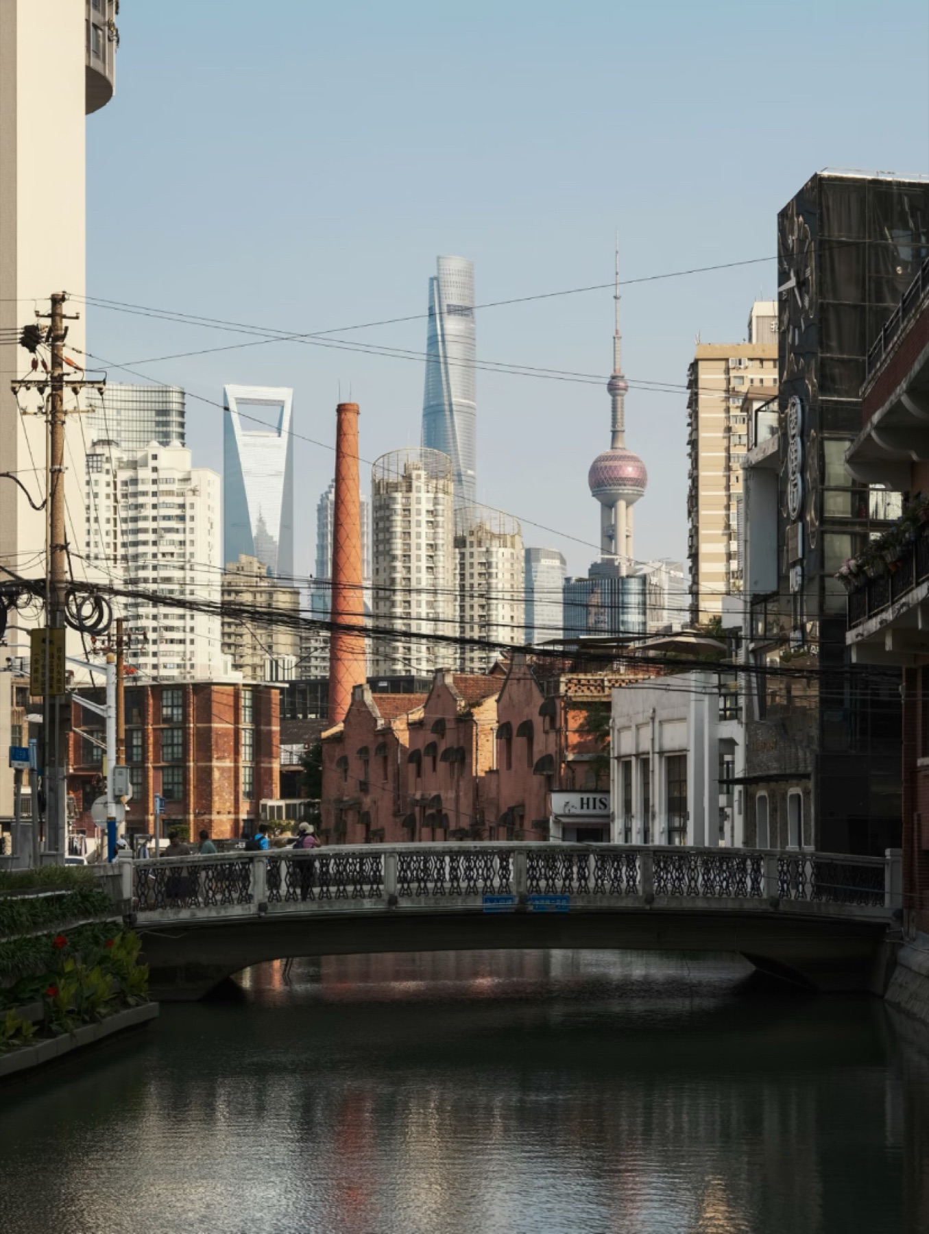 Pudong skyline rising behind old Shanghai rooftops