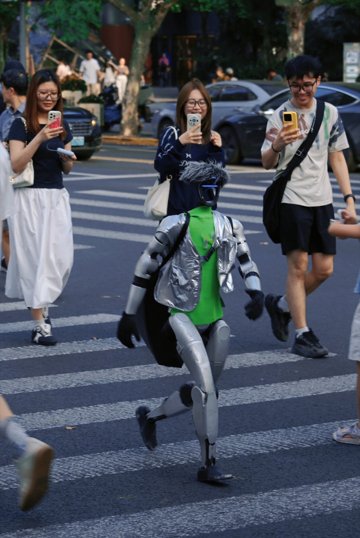 A humanoid robot walking among pedestrians in Shenzhen